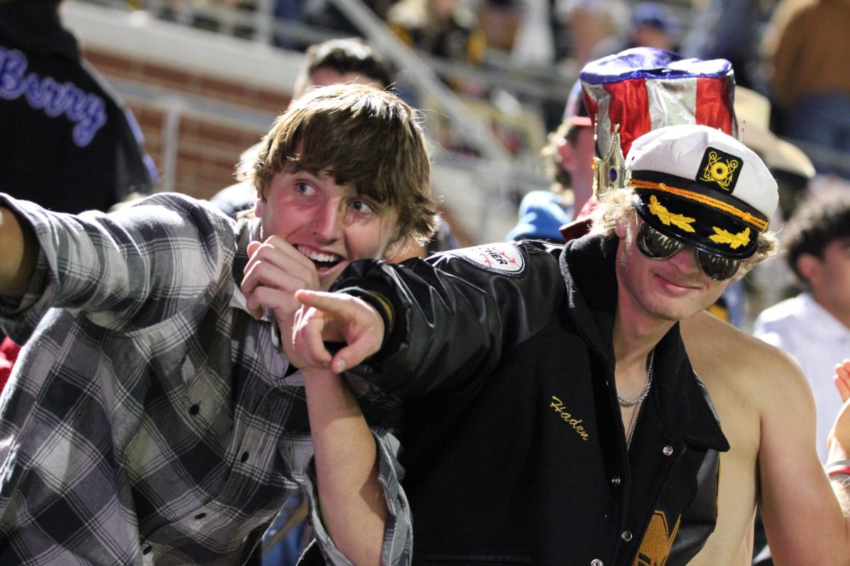 Two seniors pose during the 2023-24 senior night game against DeSoto.