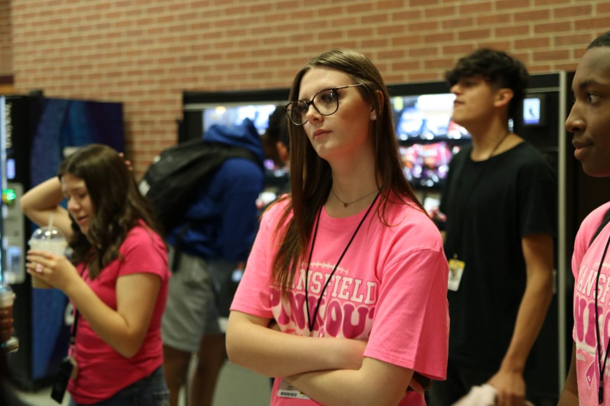 Student watches during class tour