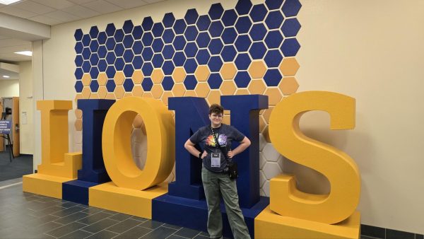 Picture of Loryn Coyne in front of a Lions sign at East Texas A&M University