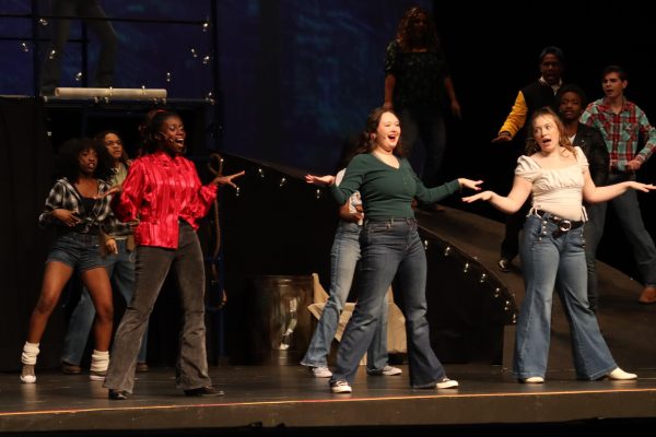 Urleen, Rusty, and Wendy Jo singing in the opening number of "Footloose"